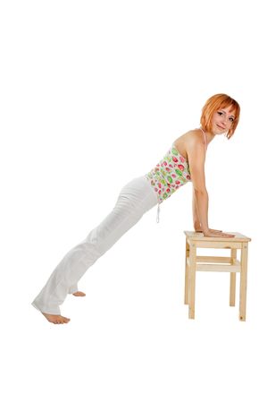 Young red-haired fitness girl isolated on white backgroundの写真素材