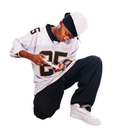 Cool hip-hop young man isolated on white playing on pspの写真素材
