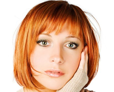 One young red girl closeup on white backgroundの写真素材