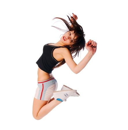 Excited young girl jumping on white backgroundの写真素材