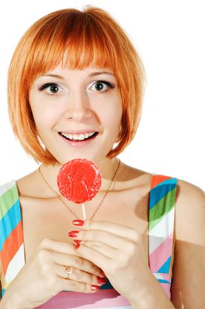 beautiful red girl with candy isolated on white backgroundの写真素材