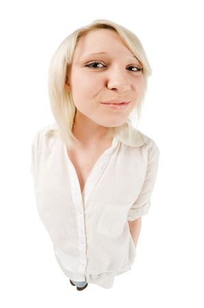 Cute teenage girl shot with fisheye lens on white backgroundの写真素材