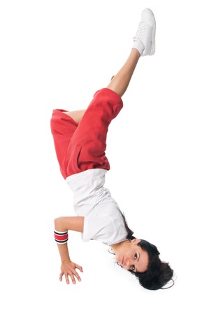 Cool breakdancer performing difficult handstand on whiteの写真素材