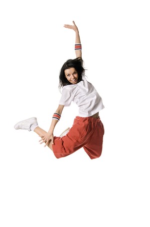 Cheerful breakdancer leaping high on white backgroundの写真素材