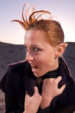 Beautiful red woman in the desert of Egyptの写真素材