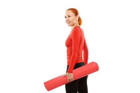 Red woman with yoga matの写真素材
