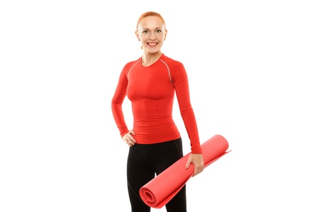 Red woman with yoga matの写真素材