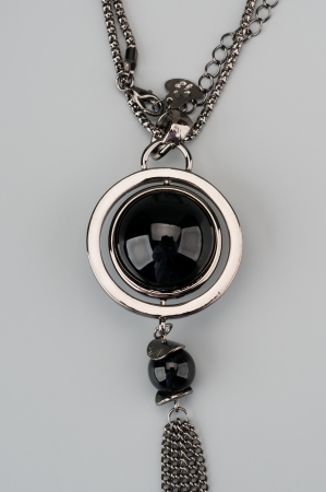 Silver pendant with large black gemの写真素材