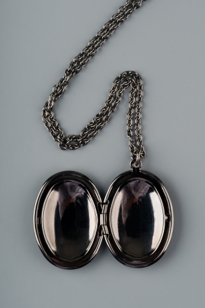 Silver pendant on a chainの写真素材