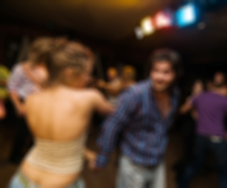 People dancing at the party abstract blur background with bokehの写真素材