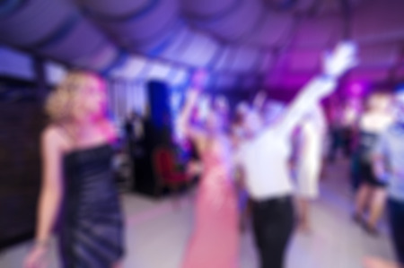 People dancing at the party abstract blur background with bokehの写真素材