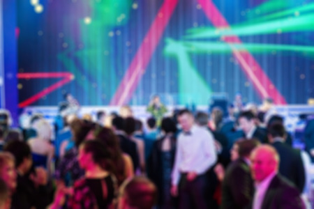 People dancing at the party abstract blur background with bokehの写真素材