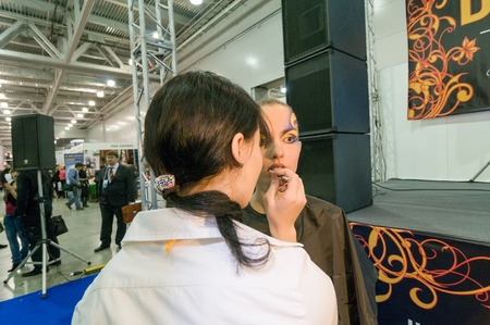 MOSCOW, RUSSIA - October 28, 2009 - Participants of makeup and hair artists competition  at Intercharm exhibition public eventのeditorial素材
