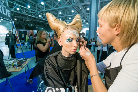 MOSCOW, RUSSIA - October 28, 2009 - Participants of makeup and hair artists competition  at Intercharm exhibition public eventのeditorial素材