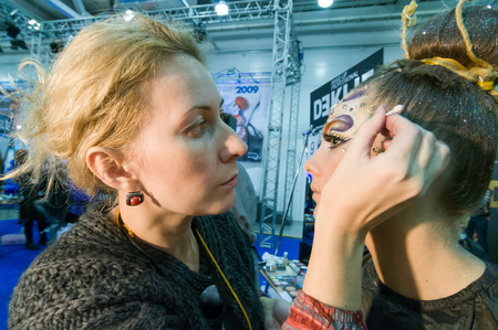 MOSCOW, RUSSIA - October 28, 2009 - Participants of makeup and hair artists competition  at Intercharm exhibition public eventのeditorial素材