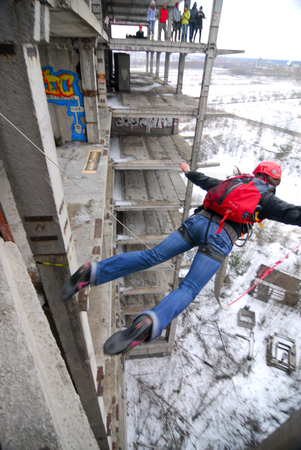 ZHELEZNODOROZHNIY, RUSSIA - March 9, 2008 - Rope jumping event held at the abandoned building construction site. Sports enthusiast groups organize such events for adrenaline lovers from all over Moscow districtのeditorial素材