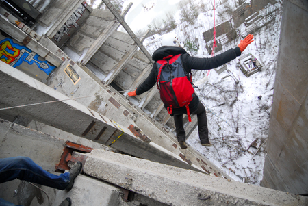 ZHELEZNODOROZHNIY, RUSSIA - March 9, 2008 - Rope jumping event held at the abandoned building construction site. Sports enthusiast groups organize such events for adrenaline lovers from all over Moscow districtのeditorial素材