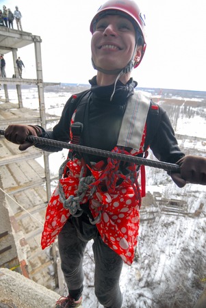 ZHELEZNODOROZHNIY, RUSSIA - March 9, 2008 - Rope jumping event held at the abandoned building construction site. Sports enthusiast groups organize such events for adrenaline lovers from all over Moscow districtのeditorial素材