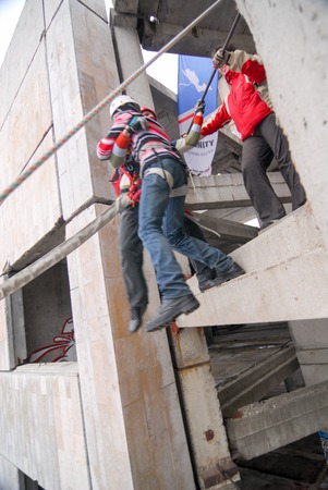 ZHELEZNODOROZHNIY, RUSSIA - March 9, 2008 - Rope jumping event held at the abandoned building construction site. Sports enthusiast groups organize such events for adrenaline lovers from all over Moscow districtのeditorial素材