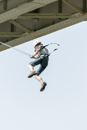 MOROZKI, RUSSIA - May 27, 2007 - Ropejumpers jumping off the bridgeのeditorial素材