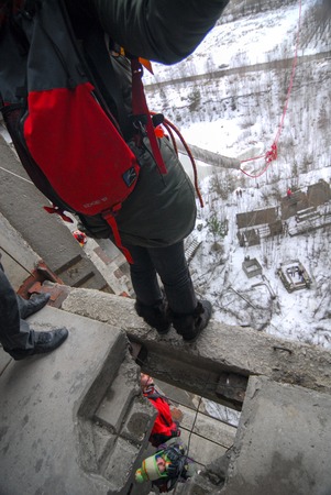 ZHELEZNODOROZHNIY, RUSSIA - March 9, 2008 - Rope jumping event held at the abandoned building construction site. Sports enthusiast groups organize such events for adrenaline lovers from all over Moscow districtのeditorial素材