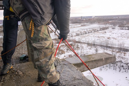 ZHELEZNODOROZHNIY, RUSSIA - March 2, 2008 - Rope jumping event held at the abandoned building construction site. Sports enthusiast groups organize such events for adrenaline lovers from all over Moscow districtのeditorial素材
