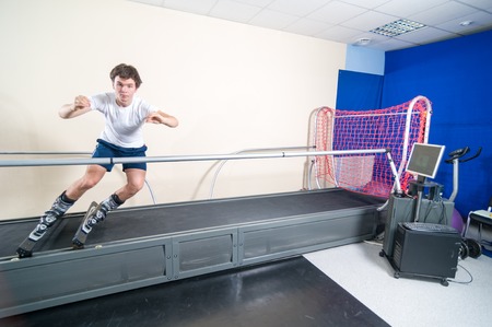 MOSCOW, RUSSIA - September 23, 2010 - Athlete working out on interactive ski simulator at the gymのeditorial素材