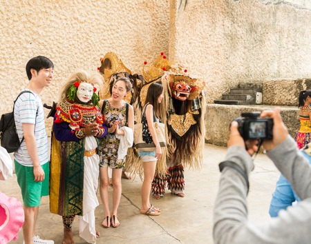 GWK, Bali Indonesia - May 14, 2013 - Tourists taking snaps after Barong Dance show, the traditional...