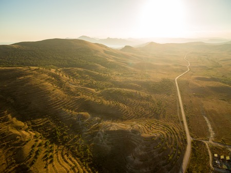 Late summer sunset aerial landscape in Crimea mountains near Black Sea