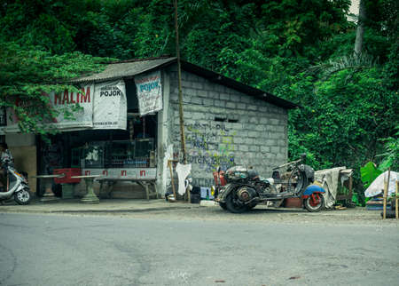 UBUD, BALI INDONESIA - April 18, 2013: Motorcycles near the grocery storeのeditorial素材