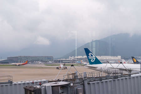 HONG KONG, CHINA - April 17, 2013: Cathay Pacific Airplane docked getting ready to flight at Hong Kong International airportのeditorial素材