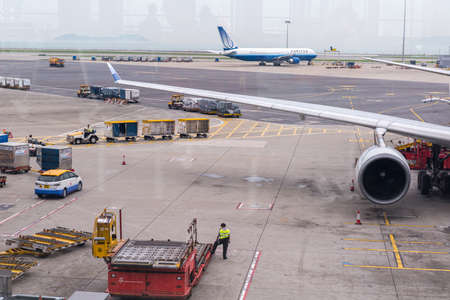 HONG KONG, CHINA - April 17, 2013: Cathay Pacific Airplane docked getting ready to flight at Hong...