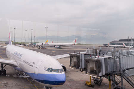 HONG KONG, CHINA - April 17, 2013: China Airlines Airplane docked getting ready to flight at Hong Kong International airportのeditorial素材