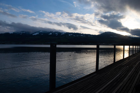 Steps into serenity walking toward the sunset with mountains rising in the distance.