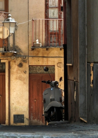 classic Vespa in the alley of Castelbuono, Sicilyのeditorial素材