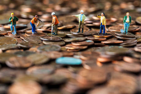 Conceptual photo of workers working on the economy.