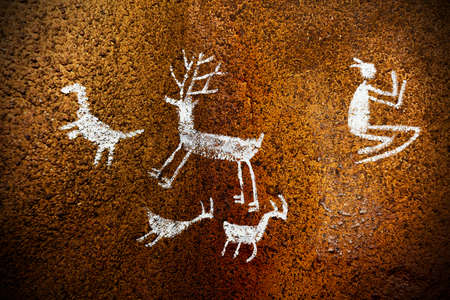 Close-up shot of some prehistoric drawings on a cave wall.の写真素材