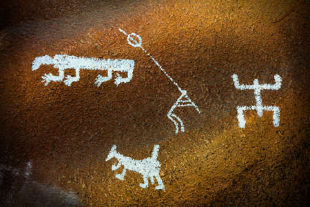 Close-up shot of some prehistoric drawings on a cave wall.の写真素材