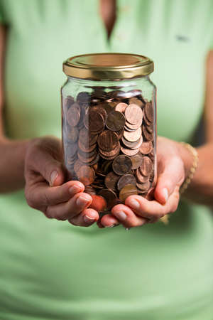 A jar of American coins.の写真素材