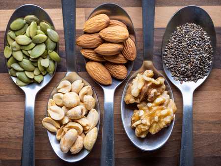Fresh nuts on spoons.の写真素材