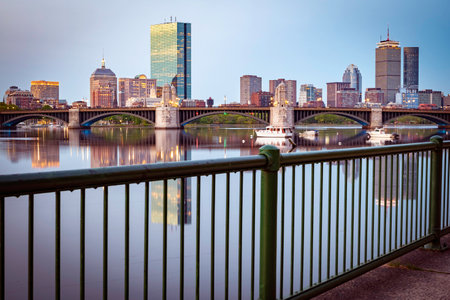 Boston downtown skyline with river and bridge at sunset, Massachusetts, USA.の写真素材
