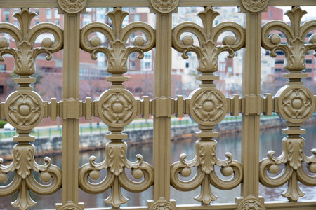 Architectural detail of a forged metal gate on a bridge.の写真素材