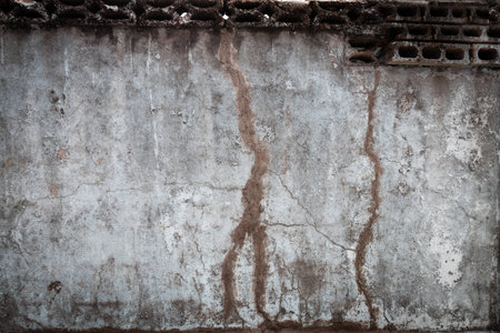 A considerably weathered and decayed blank wall.