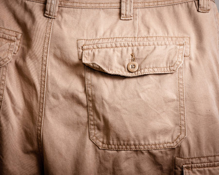 Close-up of a back pocket on a pair of khakis.の写真素材