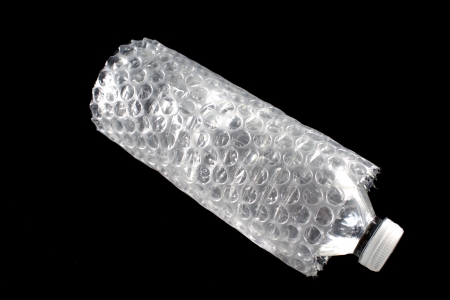 Bottle of water surrounded in wrapの写真素材