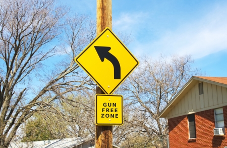 Road sign stating gun free zoneの写真素材