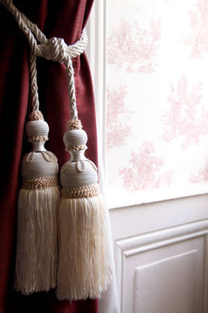 French Toile De Jouy Wallpaper with Tassel Tie-Back Curtainsの写真素材