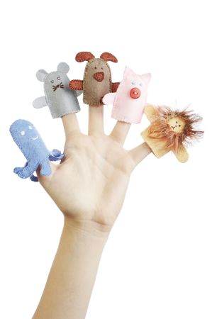 Girl's hand with animal finger puppets (pig, lion, mouse, octopussy, dog)の写真素材