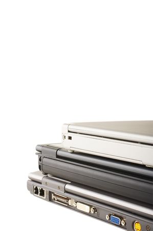 Three laptops stacked on the white backgroundの写真素材