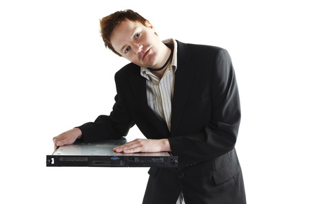 Young man leaning on one unit size rack serverの写真素材